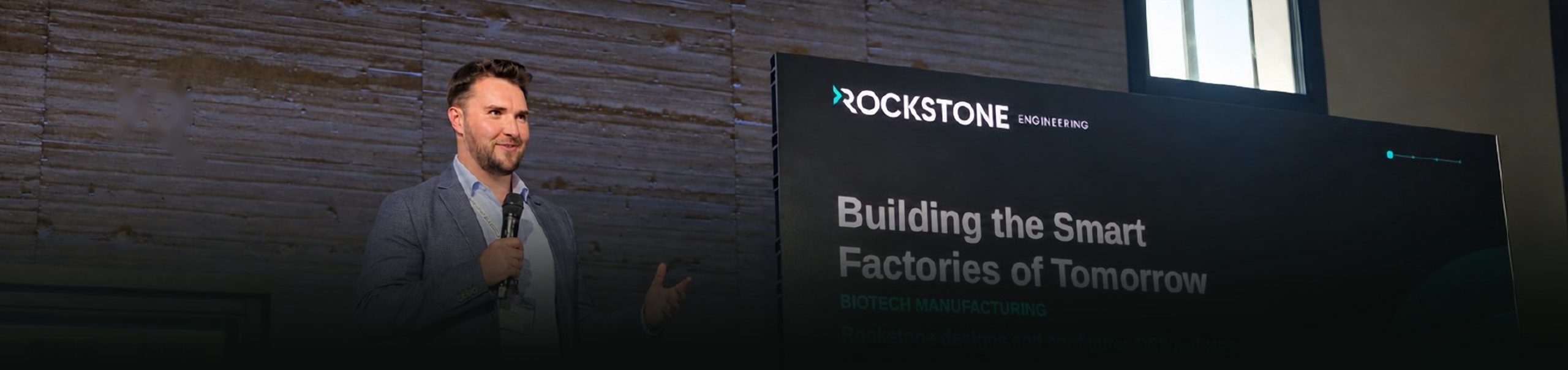 Christopher Greenan of Rockstone Engineering speaking on stage at ILMAC Lausanne 2026.